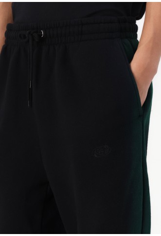 YOURTURN UNISEX - Tracksuit bottoms - black