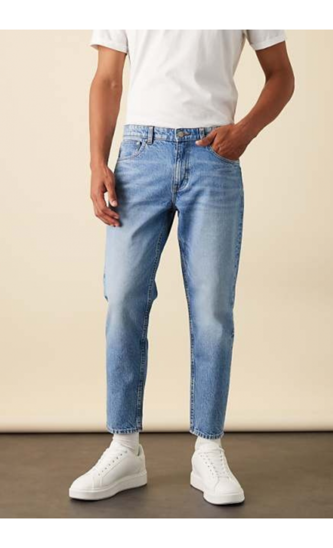 ASOS DESIGN tapered jeans in light wash blue