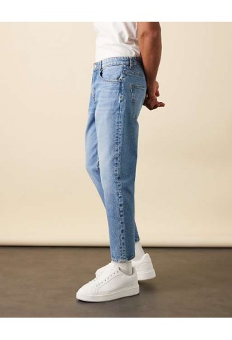 ASOS DESIGN tapered jeans in light wash blue