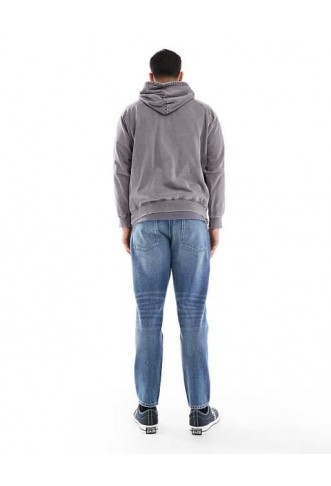 ASOS DESIGN tapered fit jeans in mid wash blue