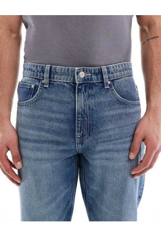 ASOS DESIGN tapered fit jeans in mid wash blue