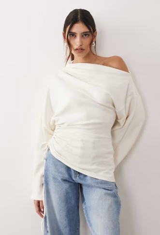 ARRANGE jersey off shoulder...