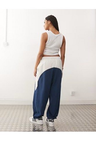 COLLUSION Unisex nylon panelled tracksuit bottoms