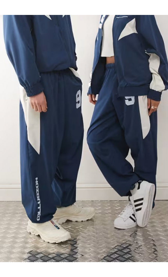 COLLUSION Unisex nylon panelled tracksuit bottoms
