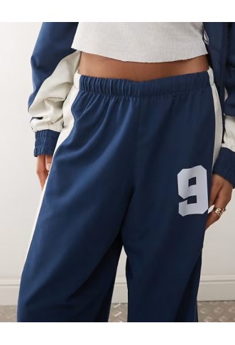 COLLUSION Unisex nylon panelled tracksuit bottoms
