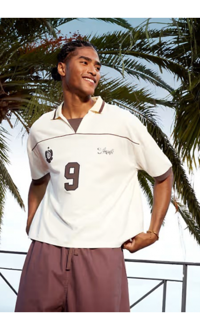 ASOS DESIGN boxy oversized football polo with piping detail in cream