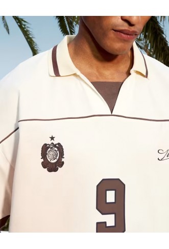 ASOS DESIGN boxy oversized football polo with piping detail in cream