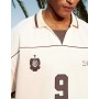 ASOS DESIGN boxy oversized football polo with piping detail in cream