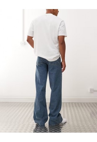 COLLUSION flare jean in mid wash and tobacco stitching