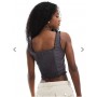 Monki frill edge corset top with lace up detail in off black