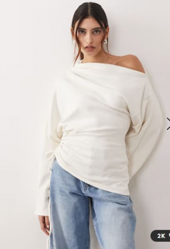 ARRANGE jersey off shoulder...