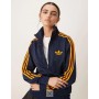 adidas Originals Firebird Loose track top in navy and orange