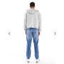 ASOS DESIGN tapered jeans in light wash blue