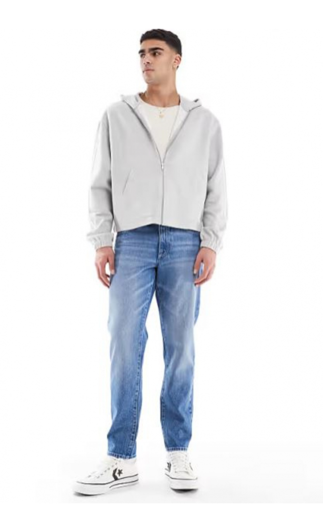 ASOS DESIGN tapered jeans in light wash blue