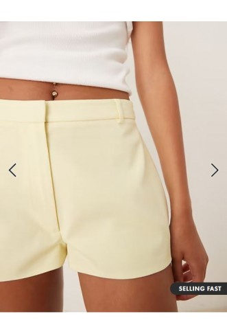 ASOS DESIGN tailored micro shorts in lemon