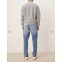 ASOS DESIGN tapered jeans in mid wash blue