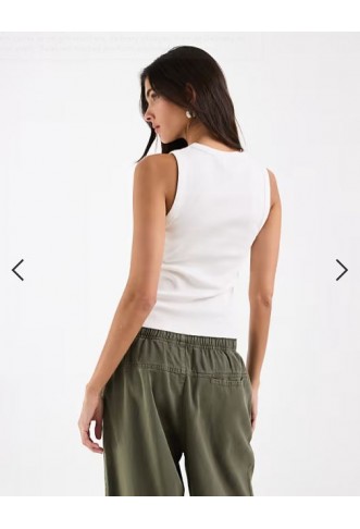 ASOS DESIGN ribbed popper detail vest in white