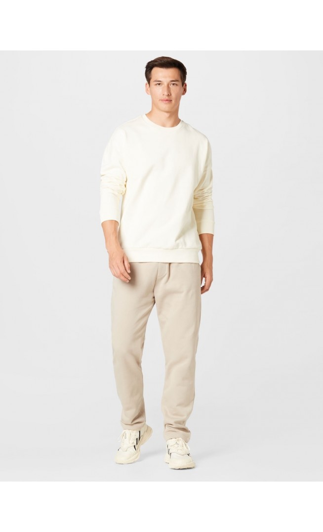 Kosta Williams x About You Regular Trousers in Beige