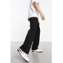 Weekday Raheem smart jersey trousers with side poppers in black