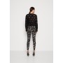 ONLSARA - Leggings - Trousers - black